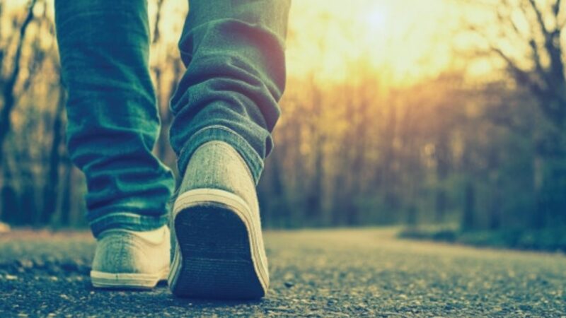 person walking on a road