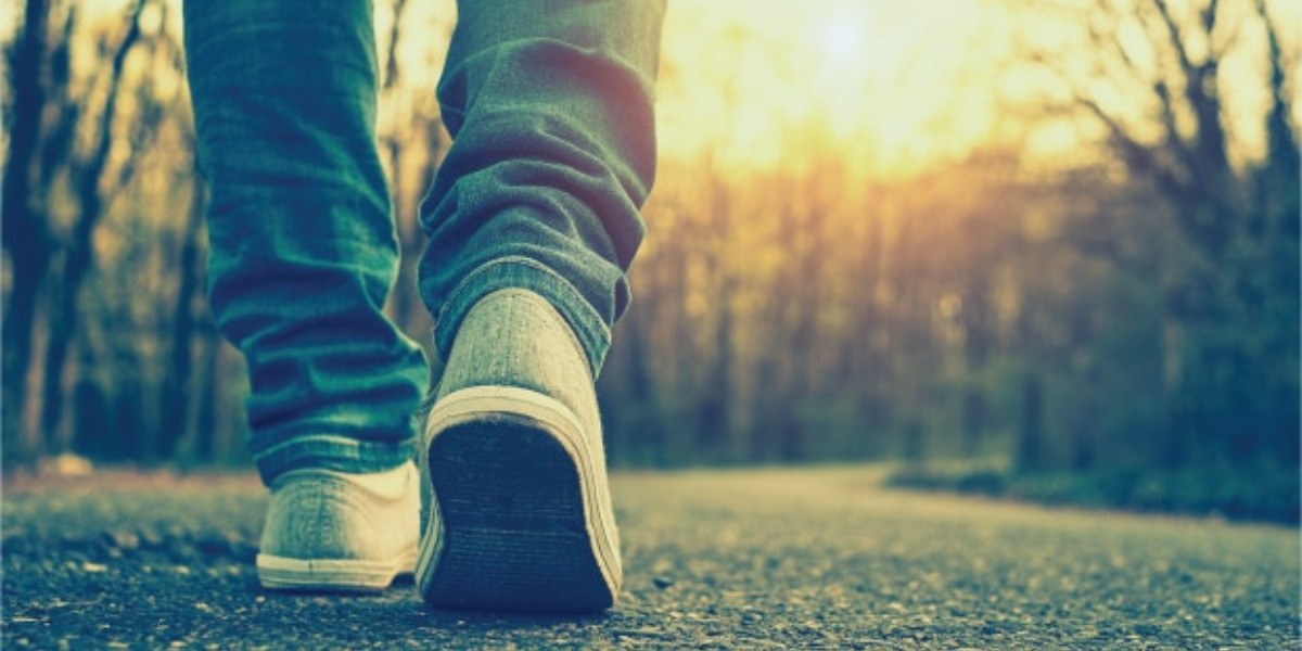 person walking on a road