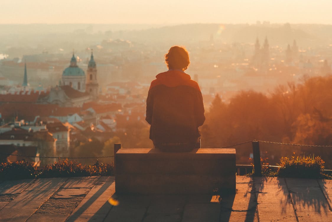 person contemplating a city view