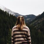 person staring at a mountain landscape