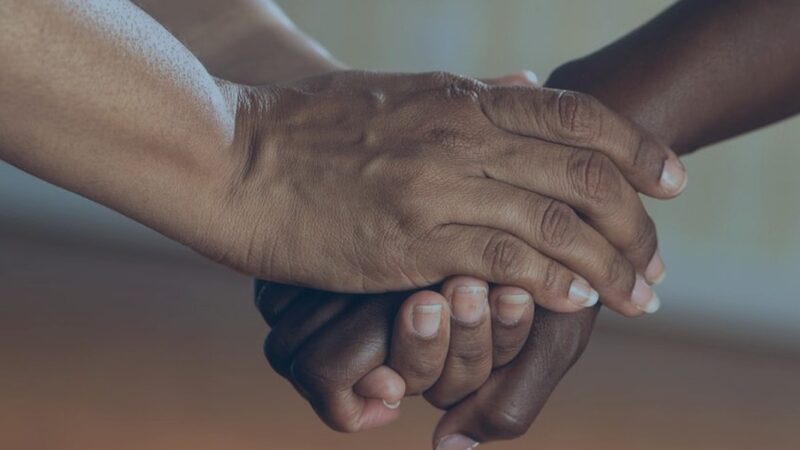 two people holding hands