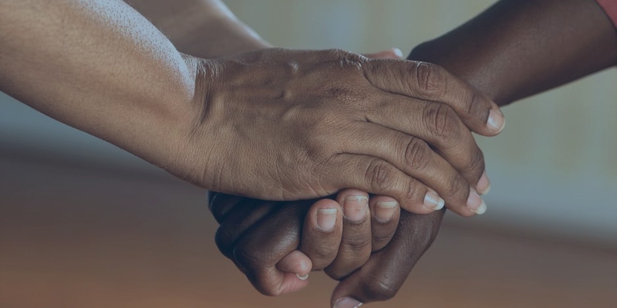 two people holding hands