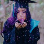 college grad with confetti
