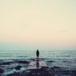 person standing on a dock