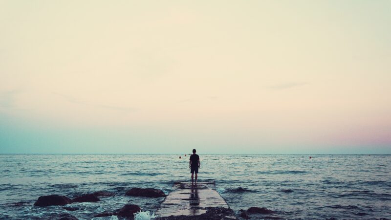 person standing on a dock