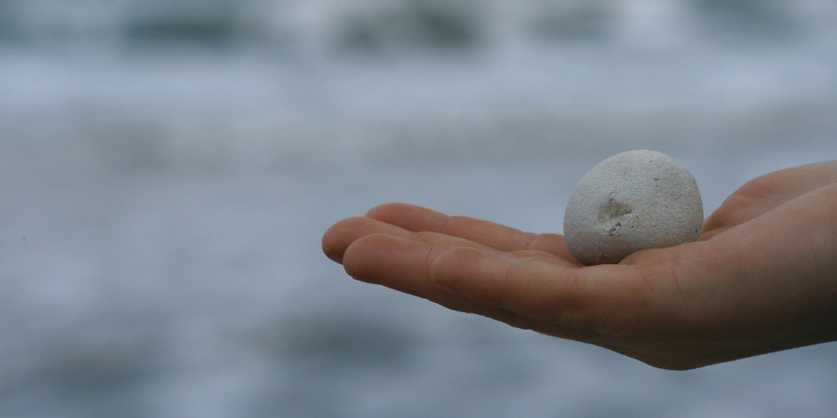 hand holding a stone