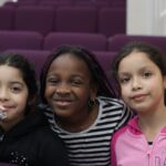 3 smiling little girls