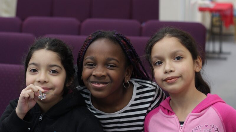 3 smiling little girls