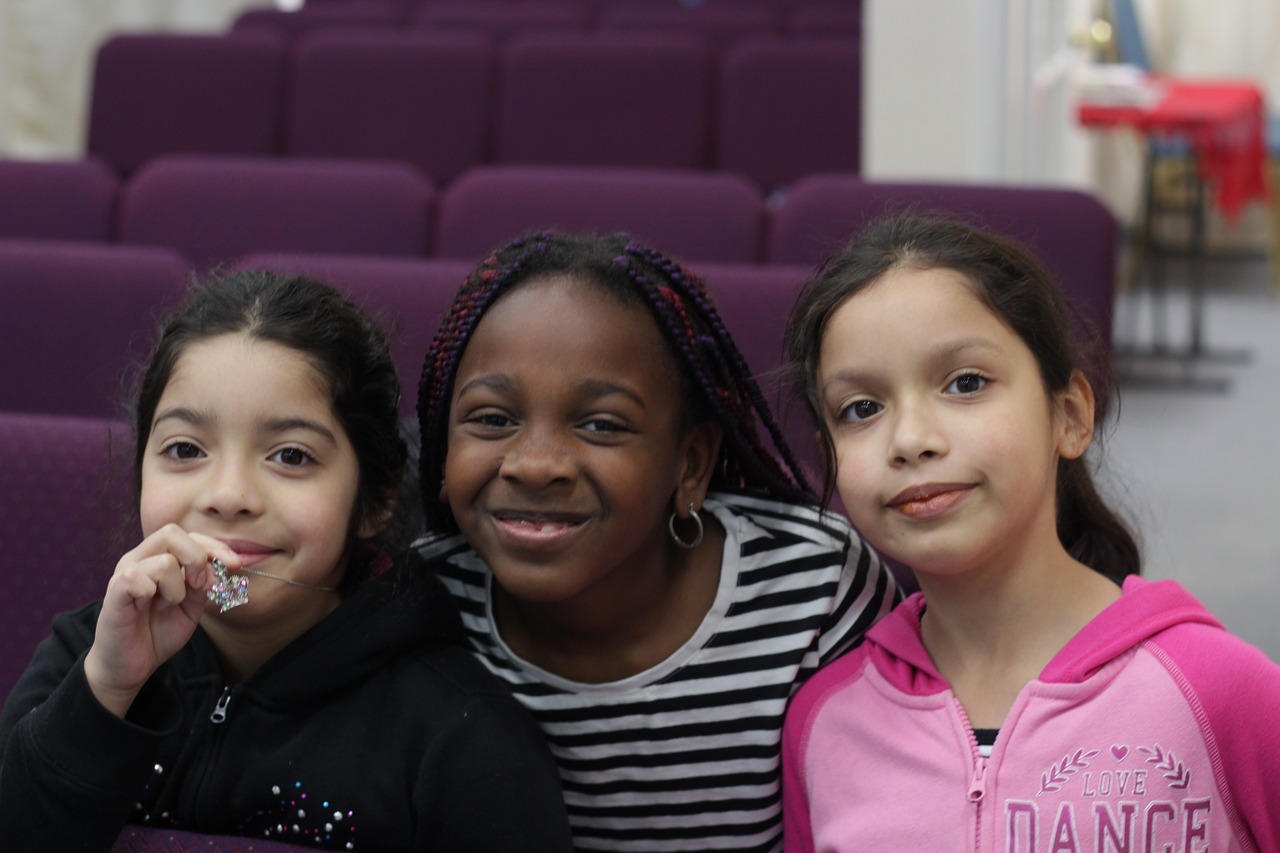 3 smiling little girls