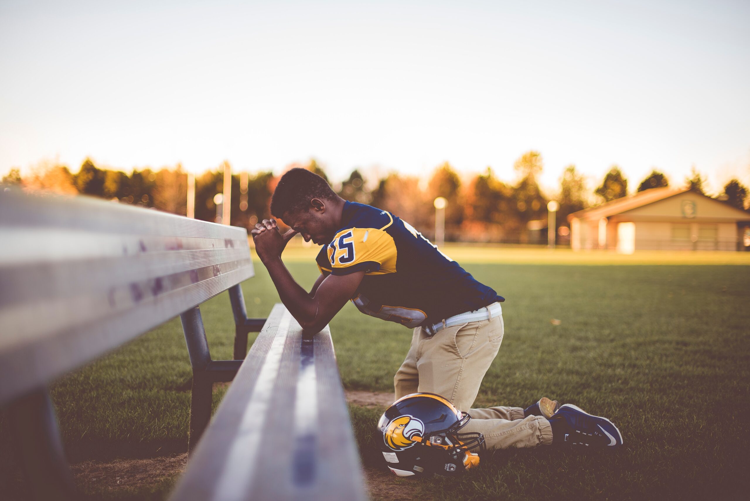 football player praying