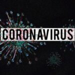 Coronavirus illustration with labeled text, depicting virus particles on a dark background.