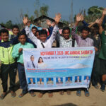 Group of people holding a banner for the IMC Annual Sabbath event, November 7, 2020, in an outdoor setting.