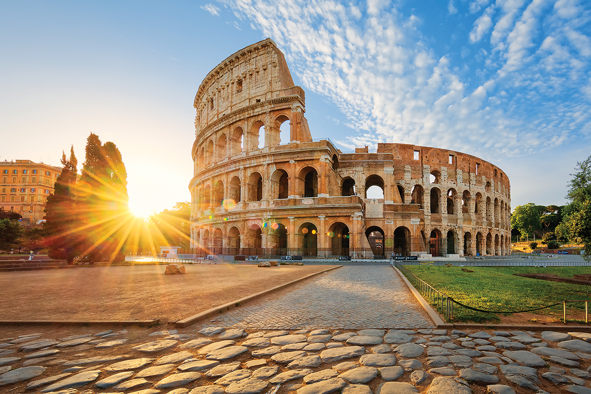 Colosseum in Rome and morning sun, Italy