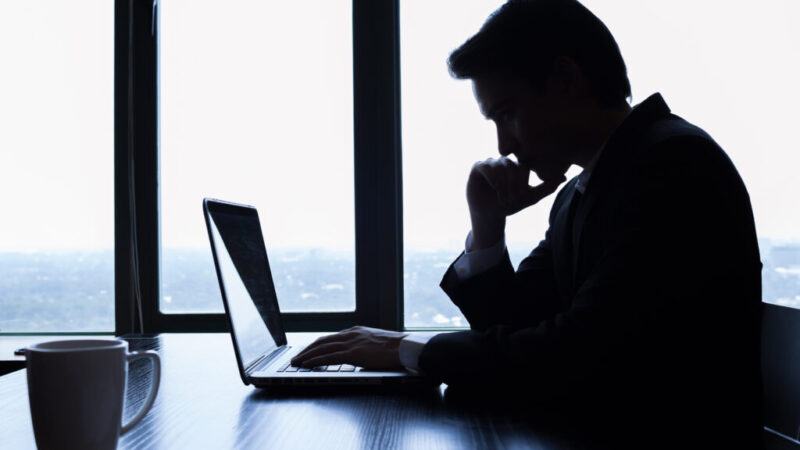 Businessman using laptop in the office