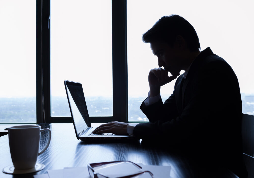 Businessman using laptop in the office