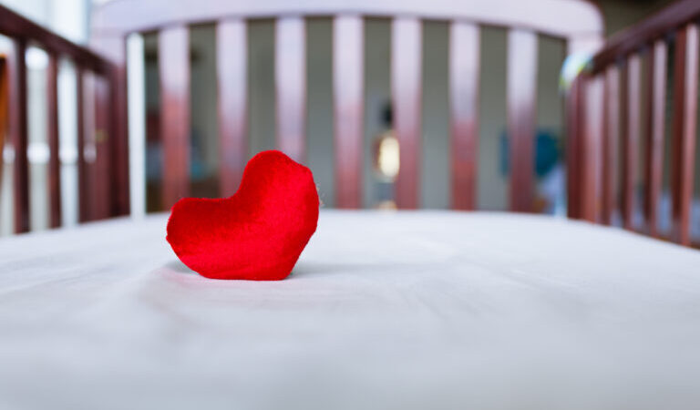 Heart in baby's crib